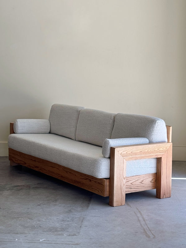 SCULPTURAL OAK + BOUCLE SOFA CIRCA 1950S